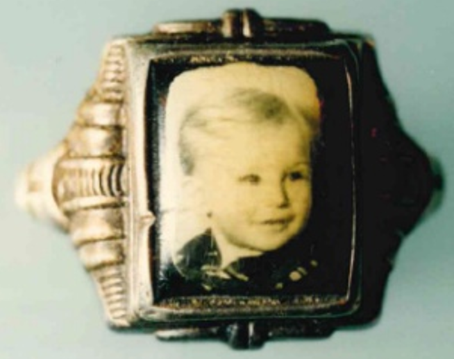 Ring with a photograph of boy 